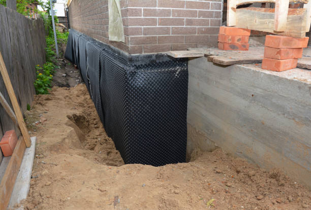 Happy homeowners after waterproofing job in Kendall Park